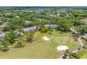 Aerial view of a well-maintained community near a golf course, showcasing lush green surroundings at 4212 Fairway Cir, Tampa, FL 33618