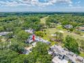 Beautiful aerial view of a townhome community with lush greenery and a nearby golf course at 4212 Fairway Cir, Tampa, FL 33618