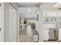 Bright hallway with stylish tile flooring leading into the well-lit living area at 6205 Shoreline Dr # 1204, St Petersburg, FL 33708