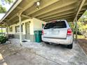 View of the carport area, with parking and access to the home's side entrance at 6350 55Th N Ave, St Petersburg, FL 33709