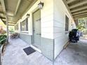 Covered front entrance featuring decorative front door and sidelight windows at 6350 55Th N Ave, St Petersburg, FL 33709