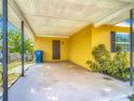 Spacious carport providing covered parking and shelter from the elements with access to the house at 7280 Tarrytown Dr, Spring Hill, FL 34606