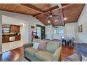 Inviting living room featuring hardwood floors, an arcade game, and a cozy atmosphere at 9118 Brunswick Ln, Tampa, FL 33615