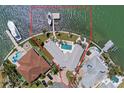 Waterfront property featuring a large triangular lot, boat dock, and swimming pool at 11050 7Th E St, Treasure Island, FL 33706