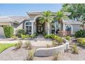 This home features meticulously maintained landscaping, a paved walkway, and a charming facade, enhancing its curb appeal at 1307 Forestedge Blvd, Oldsmar, FL 34677