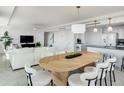 Spacious living and dining area with modern furnishings, perfect for entertaining guests at 223 Island Way # 5D, Clearwater Beach, FL 33767