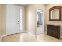 Inviting foyer with neutral paint, tile floors, and a view into another room at 3204 Mapleridge Dr, Lutz, FL 33558