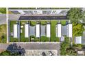 Overhead aerial shot of modern townhomes, each boasting a private rooftop terrace with seating and shading at 4215 W North A St # 3, Tampa, FL 33609