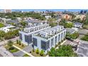 Aerial view of the modern townhome featuring private rooftop terraces and lush green surroundings at 4215 W North A St # 3, Tampa, FL 33609
