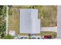 Aerial view of the house showing the roof, driveway, and surrounding yard space at 5111 Eldorado Dr, Tampa, FL 33615
