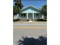 Inviting single-story home with a lovely front porch and attractive blue exterior at 641 N Garden Ave, Clearwater, FL 33755