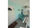 Charming porch with comfortable chairs and a lovely welcome mat at 641 N Garden Ave, Clearwater, FL 33755