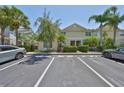 Exterior view of a light-colored townhouse with visitor parking spots available at 11029 Winter Crest Dr Dr, Riverview, FL 33569