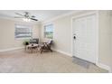 Inviting living room with neutral paint, two windows and ceiling fan at 1120 45Th N St, St Petersburg, FL 33713