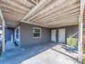 Spacious covered area with an ample room for parking and access to two entry doors at 11397 122Nd Ave, Largo, FL 33778