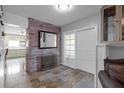 This entryway features rustic brick accents and unique tile flooring at 2014 E Broad St, Tampa, FL 33610