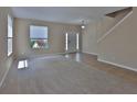 Bright living room with neutral carpet and tile floors, and natural light at 2463 Carnation Ct, North Port, FL 34289