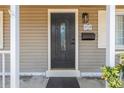 Elegant front door with decorative glass, complemented by updated fixtures and the house number 2719 at 2719 Boca Ciega N Dr, St Petersburg, FL 33710