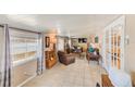 Inviting living room featuring comfortable seating, neutral tones, and ample natural light at 27466 Us Highway 19 N # 56, Clearwater, FL 33761
