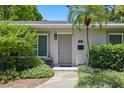 Inviting front entrance with well-maintained landscaping and a stylish front door at 301 62Nd S Ave, St Petersburg, FL 33705