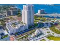 Beautiful aerial view of a modern high rise near a waterway, showing the surrounding cityscape and amenities at 331 Cleveland St # 1202, Clearwater, FL 33755