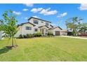 Expansive front yard showcases this two-story house and detached garage at 4166 38Th S St, St Petersburg, FL 33711