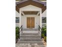 Inviting entryway with a double door and an overhead wood ceiling at 4166 38Th S St, St Petersburg, FL 33711