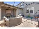 Cozy screened-in patio with comfortable seating, outdoor bar, and relaxing ambiance at 4639 Bexley Village Dr, Land O Lakes, FL 34638