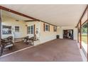 Covered parking area with ample space for vehicles and outdoor seating at 5524 Betmar Dr, Zephyrhills, FL 33542