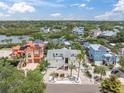 Beautiful aerial view of a waterfront home with lush landscaping and neighborhood at 633 Soundview Dr, Palm Harbor, FL 34683