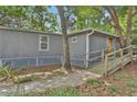 Charming home featuring a wheelchair access ramp, with beautiful, low maintenance yard at 9132 Mango St, New Port Richey, FL 34654