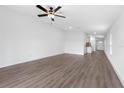Spacious living room featuring modern flooring and ample natural light at 124 Hallam Ct, Spring Hill, FL 34606
