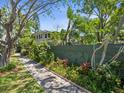 View of yard with lush landscaping and walkway, showcasing a serene outdoor setting at 125 29Th N St, St Petersburg, FL 33713