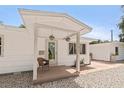 Quaint front porch with a seating area, decorative plants and a small patio at 1800 Mound S Pl, St Petersburg, FL 33712