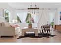 Bright living room with modern decor, natural light, and hardwood floors at 1800 Mound S Pl, St Petersburg, FL 33712