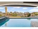 Inviting pool view offers relaxation with serene waterfront scenery and clear blue water at 1939 Hawaii Ne Ave, St Petersburg, FL 33703