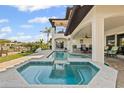 Relaxing pool and spa with patio and seating creates the perfect backyard oasis at 1939 Hawaii Ne Ave, St Petersburg, FL 33703