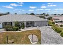 Well-maintained home with lush landscaping, a two-car garage and a charming front entrance at 204 Cactusflower Ln, Sun City Center, FL 33573