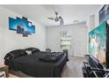 Cozy bedroom with a ceiling fan and a view of the neighborhood at 26377 Bertram Rd, Brooksville, FL 34602