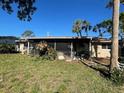 Spacious backyard featuring a screened lanai, ideal for outdoor relaxation at 5365 Dover Ne St, St Petersburg, FL 33703