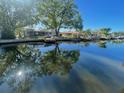 Scenic water view with lush trees reflecting off the calm water at 5365 Dover Ne St, St Petersburg, FL 33703