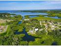 Stunning aerial view of the property surrounded by lush greenery and waterways at 6904 11Th Ave E, Palmetto, FL 34221