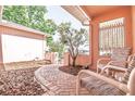 Charming patio with brick flooring and inviting seating for enjoying the outdoors at 7812 Turnbridge Dr, Port Richey, FL 34668