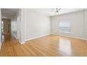 Bright bedroom with ample natural light, boasting hardwood floors and a calming ambiance at 10260 Devonshire Lake Dr, Tampa, FL 33647