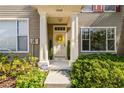 Charming front entrance with a decorative wreath and well-manicured landscaping at 12443 Country White Cir, Tampa, FL 33635