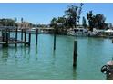 Scenic view of waterfront property featuring a boat dock at 12478 Capri Circle N # 2, Treasure Island, FL 33706