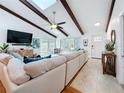 Spacious living room featuring modern decor, wood flooring, and plenty of natural light at 13891 Feather Sound Dr, Clearwater, FL 33762