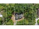 Aerial view of property showing roof, tree coverage and boundaries of the lot at 15703 Walden Ave, Tampa, FL 33618