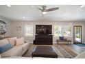 Bright living room with a large flat screen, comfortable seating, and a view of the front entrance at 3906 W De Leon St, Tampa, FL 33609