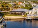 Waterfront home with a screened lanai and boat dock, ideal for enjoying waterfront living at 5603 Tybee Island Dr, Apollo Beach, FL 33572